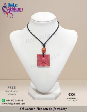 Handmade red clay pendant with square shape and beautiful flower engraving.