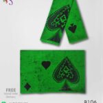 Handmade batik sarong with black and green ace design.
