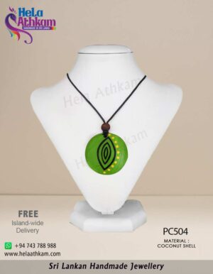 Sri Lankan handmade coconut shell pendant with beautiful light green design.