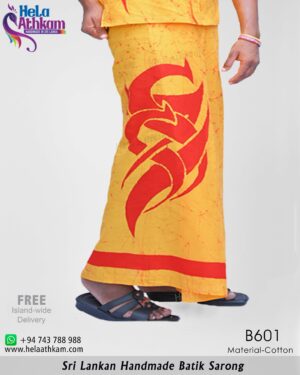 Handmade batik sarong with unique red tattoo design on an orange background.