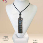 Authentic handmade red clay pendant with beautiful engravings on it.
