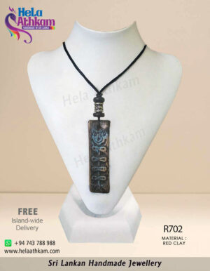 Authentic handmade red clay pendant with beautiful engravings on it.
