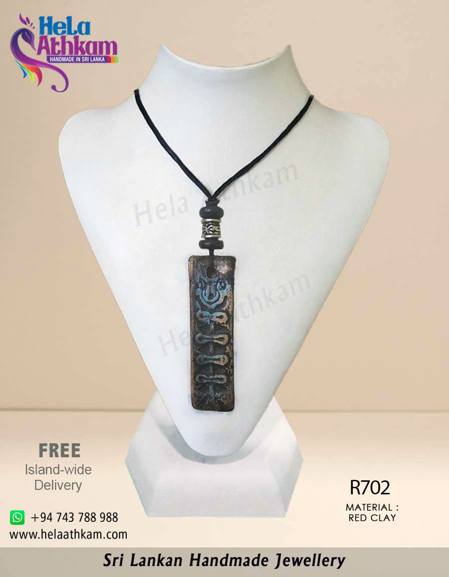 Hela Athkam Handmade Batik Product Image Authentic handmade red clay pendant with beautiful engravings on it.