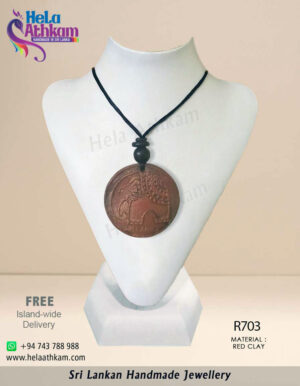 Handmade red clay pendant with elephant engraving in it.