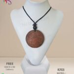 Handmade red clay pendant with elephant engraving in it.