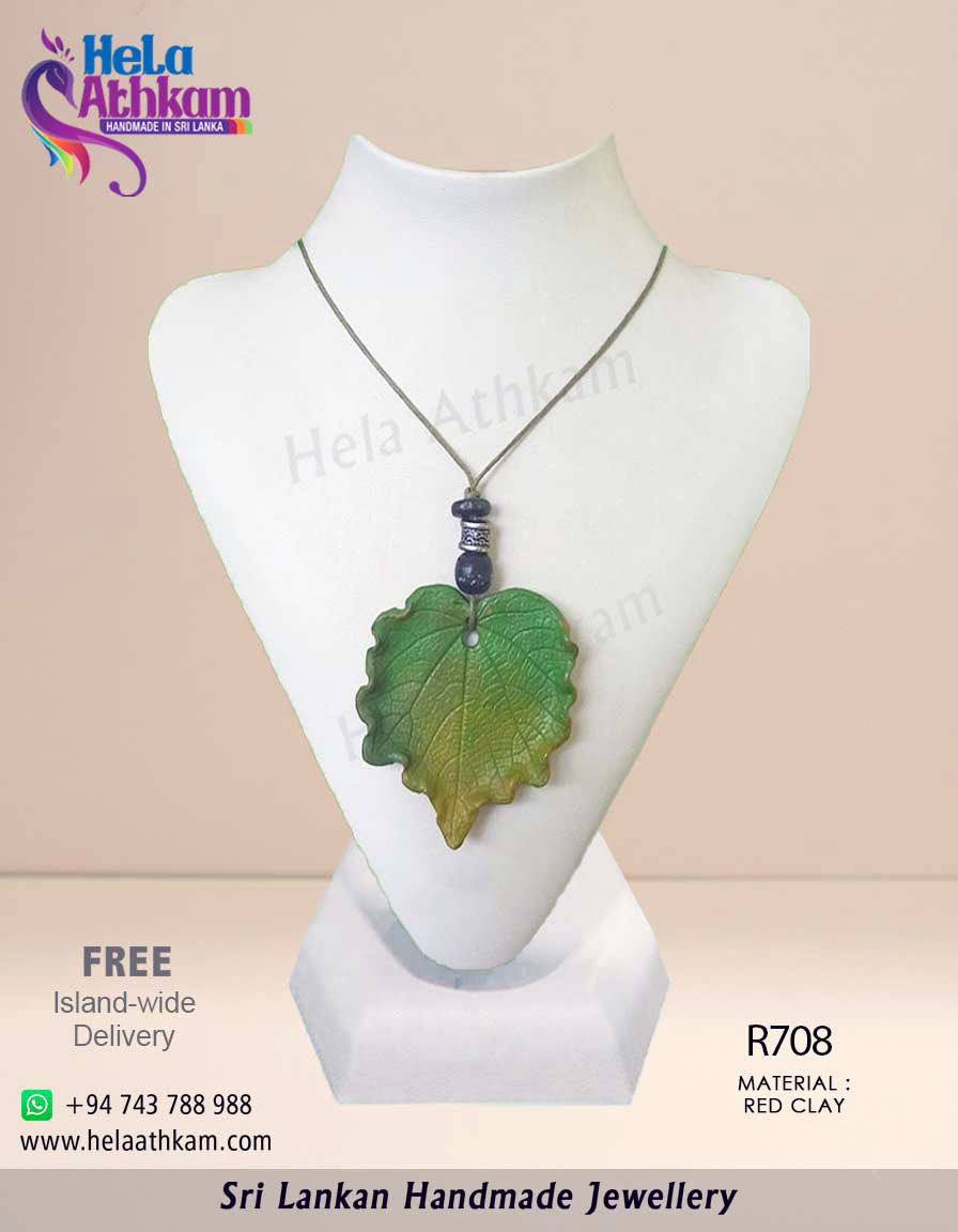 Beautiful green leaf pendant made from red clay by hand.