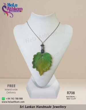 Beautiful green leaf pendant made from red clay by hand.