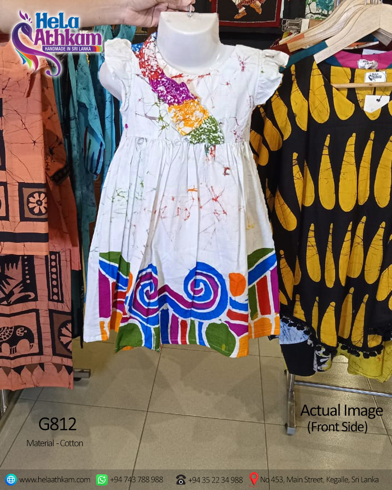 Sri Lankan handmade batik clothing baby frock with multiple colors and colourful design actual image of a front side.