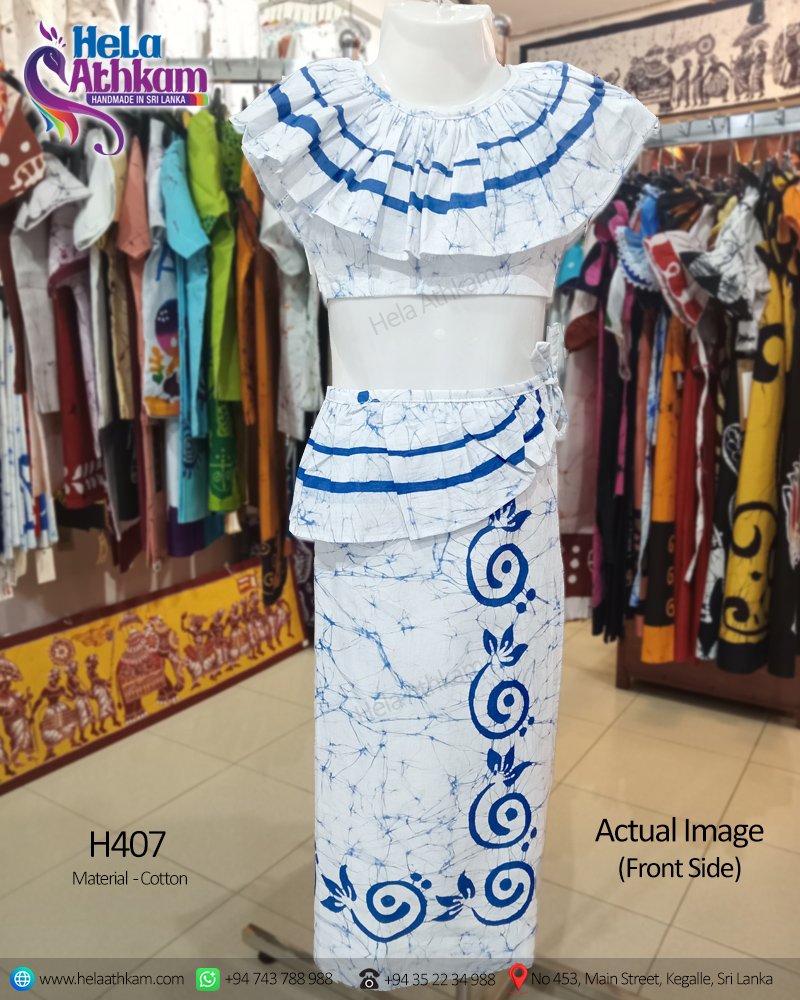 Sri Lankan handmade batik kids lamasaree with blue patterns and cracklings on a white background actual image of the front view.
