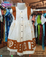 White and brown handmade batik children's dress with traditional Sri Lankan styles.