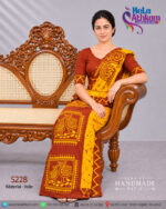 Sri Lankan handmade batik clothing made by Hela Athkam a batik osariya in golden yellow and brown colors a view of sitting on a couch.