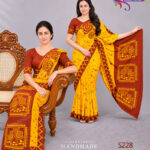 Sri Lankan handmade batik saree and osariya made by Hela Athkam using an artistic combination of golden yellow and brown colors.