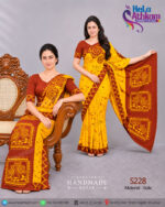 Sri Lankan handmade batik saree and osariya made by Hela Athkam using an artistic combination of golden yellow and brown colors.